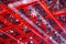 Red and white colored metal construction wih snowflake under roof of ice arena