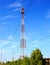 Red and white communication tower with beautiful clear sky