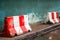 Red white concrete barrier stop going sign on street stand on footpath green painted old wall background