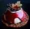 Red and white dessert with chocolate decoration, red jelly and cookie base