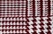 Red and white houndstooth pattern textile background