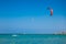 The red, white kites in the blue sky over Red sea.