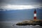 Red and white lighthouse in the Beagle Channel, Ushuaia, Tierra del Fuego, Argentina.