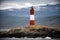 Red and white lighthouse in the Beagle Channel, Ushuaia, Tierra del Fuego, Argentina.