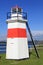 Red and white lighthouse at NW end of Crinan canal