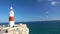 A red-white lighthouse at the southern point of europe on the coast of Gibtaltar