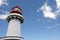 Red and white lighthouse in Topo, Sao Jorge, Azores. Portugal