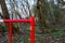 Red and white lobster in the woods. Prohibition of entering the forest. Shutter across the road. Barrier on the road