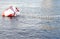 Red and white metal mooring buoys.