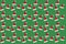 Red and white mini Santa hat floating on green background