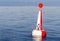Red white moored buoy