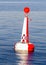 Red white moored buoy
