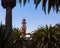 Red white painted beacon, and houses, Swakopmund, German colonial town, Namibia