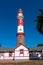 Red white painted beacon, and houses, Swakopmund, German colonial town, Namibia