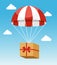 Red and White Parachute Holding Delivery Box