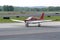 Red and White Plane on Runway