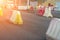 Red, white plastic safety barriers along road. Ensuring road safety with visible barriers. Effective safety measures for