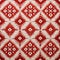 Red And White Quilt With Symmetrical Figures And Luxurious Geometry