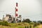 Red and white smoke exhaust stacks from the Chemical plant