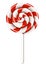 Red and white spiral lollipop on stick. Christmas candy. Isolated on white background.