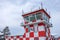 Red and white in the square of the control tower at the airport runway