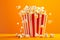 A red and white striped popcorn bucket full of fluffy, buttery popcorn, bold colors of background