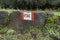 Red And White Stripes Trail Mark On Volcanic Rock In Etna Park, Sicily