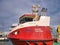 The red and white superstructure of the hybrid, diesel electric aquaculture treatment service vessel Isaac Eslea