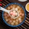 Red and white tangyuan with syrup soup