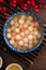 Red and white tangyuan with syrup soup