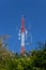 Red and white telecommunication antenna mast or mobile tower