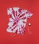 Red and white tie dye T-shirt and red and white candy on a red background. Flat lay