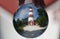 The red and white tower of Assateague Light House captured inside a lens ball near Chincoteague, Virginia U.S