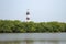 Red and white Vypin lighthouse surrounded by palm trees in Kochi, Kerala India.Puthuvype Lighthouse Bottom view.