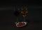 red and white wine in the glass with grapes in a ceramic bowl,on a black background, wineglass, drink set