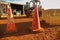 Red and white witches cone hat safety caution traffic warning sign barrier applying on the ground