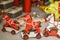 Red and white wooden horse toy for sale in a traditional handicraft store during Christmas market