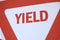 A red and white yield traffic sign