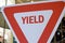 A red and white yield traffic sign