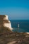 Red and whiteâ€“striped Beachy Head Lighthouse against chalk cliffs,  view from top of Seven Sisters, Clifftop Paths Nature