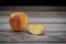 Red wilted rotten apple on a table. Bacteria infected rotten fruit