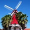 Red windmill and palms, Aruba, Island in Caribbean Sea