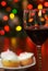 Red wine with blurred christmas lights