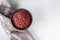 Red wine flavored salt in a bowl. Gourmet condiment to aromatize and season food