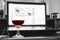 Red wine in glass with computer laptop on wooden table, relaxing while working