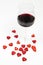 Red wine glass and red hearts isolated on white background - romantic seduction - valentines day