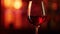 Red wine glass with warm backlit glow, intimate and cozy ambiance. Application: Fine dining, wine marketing, romantic