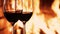 Red wine next to a fireplace, cozy and relaxing atmosphere at countryside home, romantic evening and holiday time background,