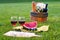 Red wine and picnic on the grass