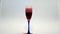 Red wine poured in glass on white background. Glass with red wine isolated